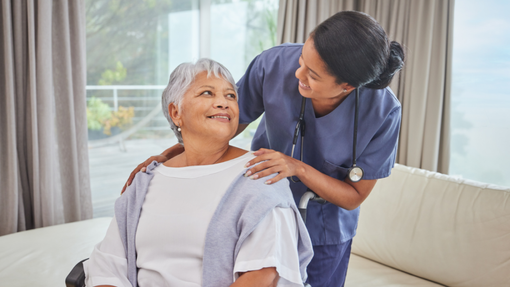 A nurse checking up on her elderly patient